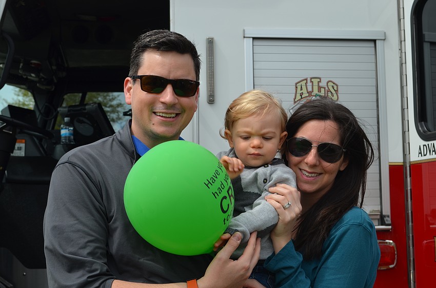 Logan, Brendan and Stephanie Aiken check out the fire truck at Springfest.