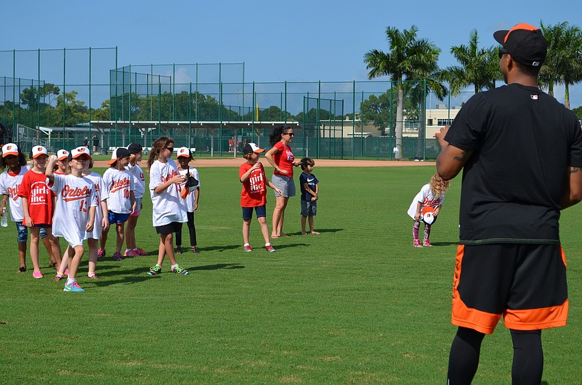 Jamill Moquete preps to receive a pitch during the Girls Inc. baseball clinic.