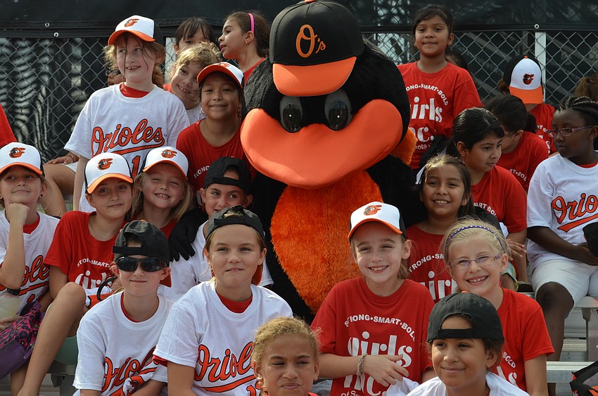 The Oriole bird makes friends with members of Girls Inc.