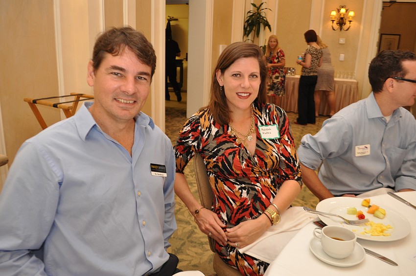 STu Henderson, of Fawley Bryant, chats with Huldah Mathis, of Northwestern Mutual.