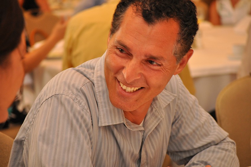 Anthony Saviano, director of sports at Premier Sports Campus, plays a mental game with others at his table.