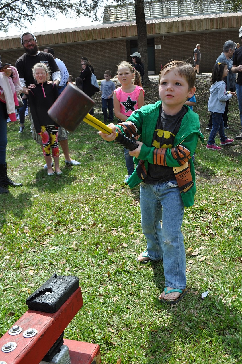 Riley Baker, 4, shows he’s a heavy lifter.