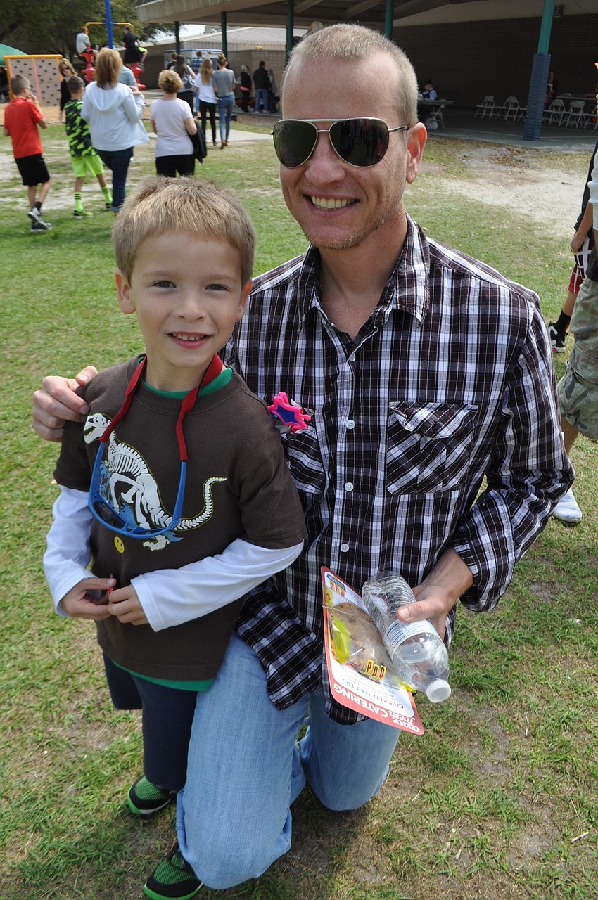 Beckham Facter, 6, with his dad, Ryan, can’t wait to win a goldfish.