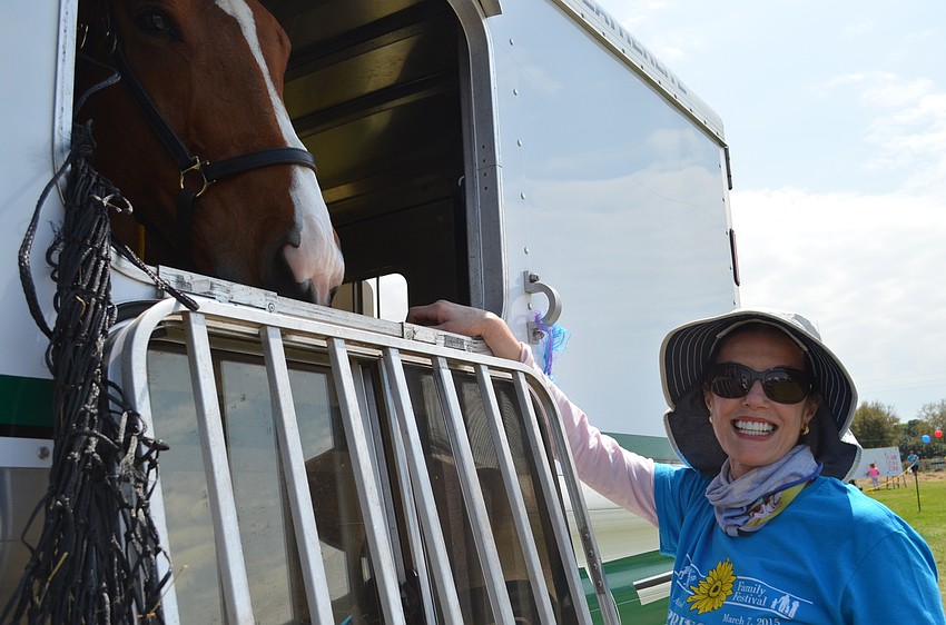 Springfest Executive Director Eliza Culverhouse pets Honor