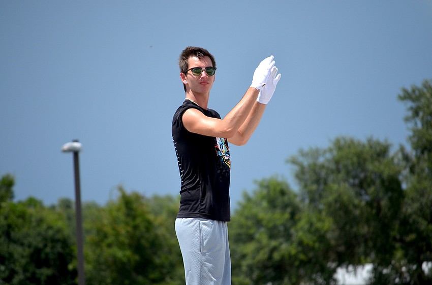 Graeme Sugden waits for his cue before leading band members.
