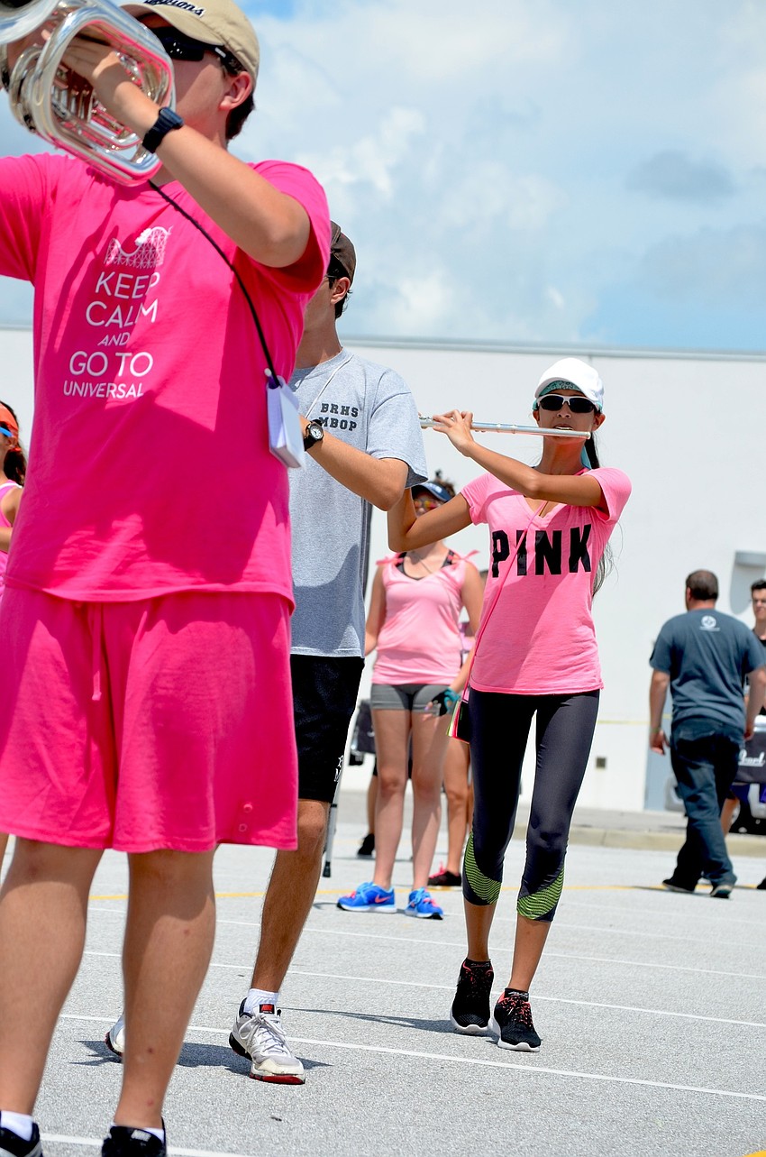 Sim My Setzer plays the flute while moving to the music.