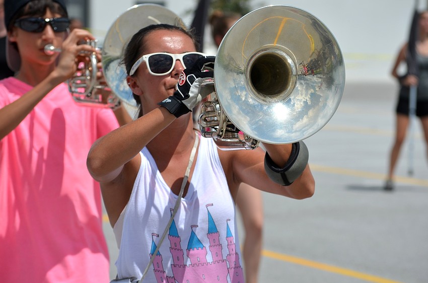 Summer Boucher plays her instrument with other section members.