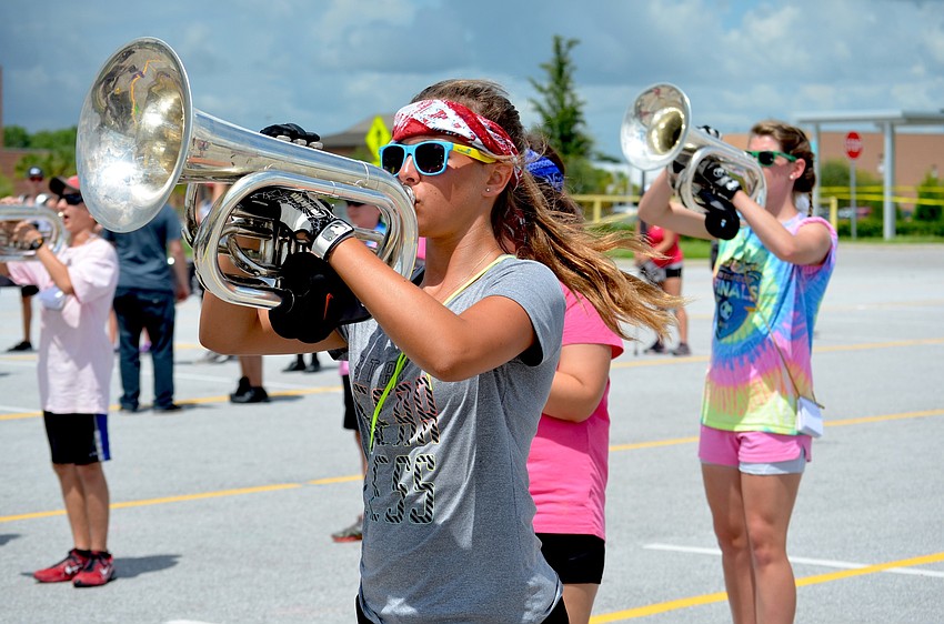 Jenna Padgett leads her section in song.