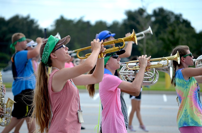 Trumpet players focus on their conductor.