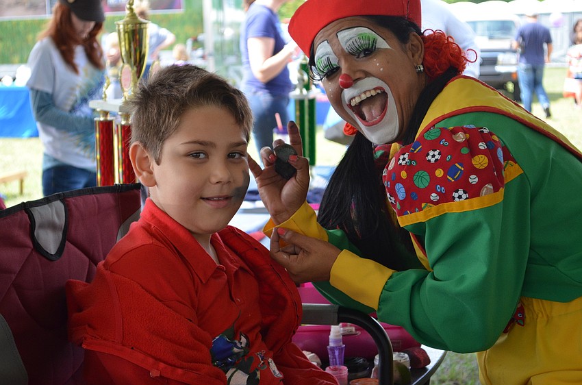 hn Mahrous has his face painted.