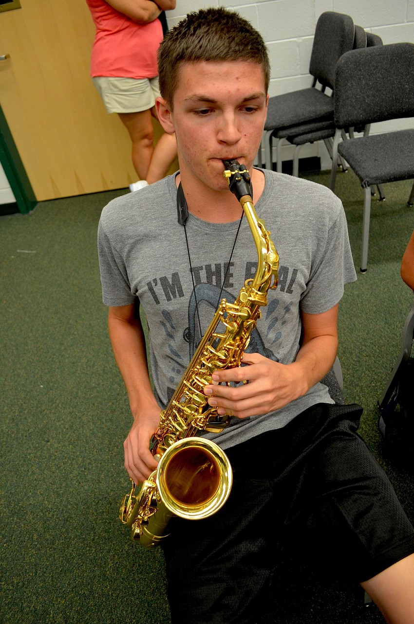 Chandler Reed croons on the saxophone.