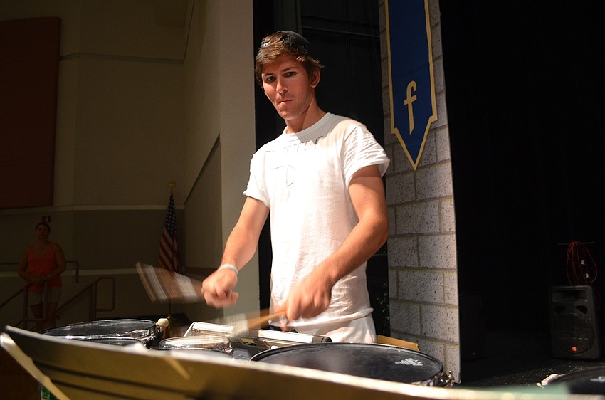 Jordan Tuttle reads and plays music.