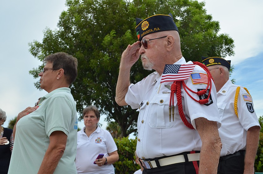 Donald Murphy salutes the presentation of the colors.