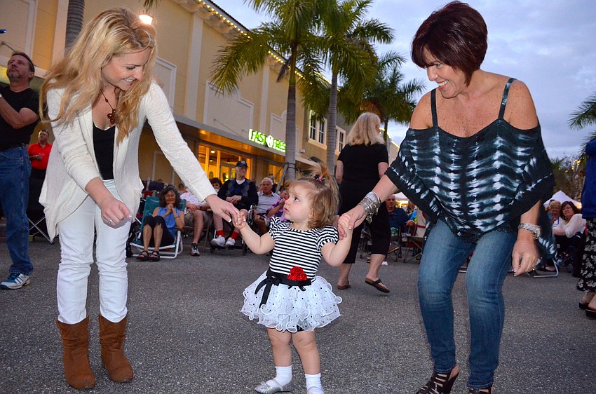 Minette Balch, Austin Marie Conner and Martha Nieves dance to the music.