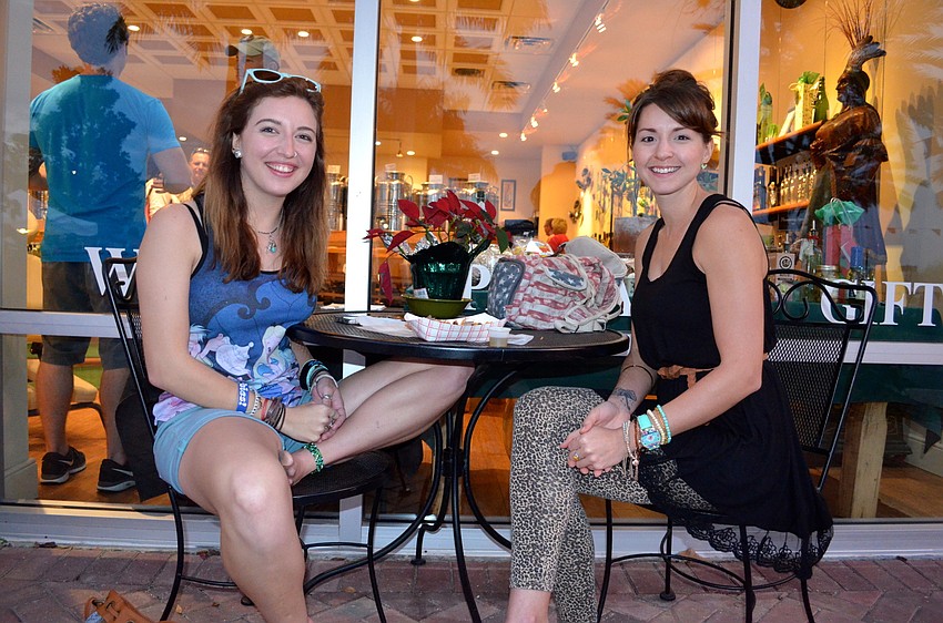 Madison Jones and Charlotte Gochnauer, of Grace Community Church, enjoy dinner during the music-filled event.
