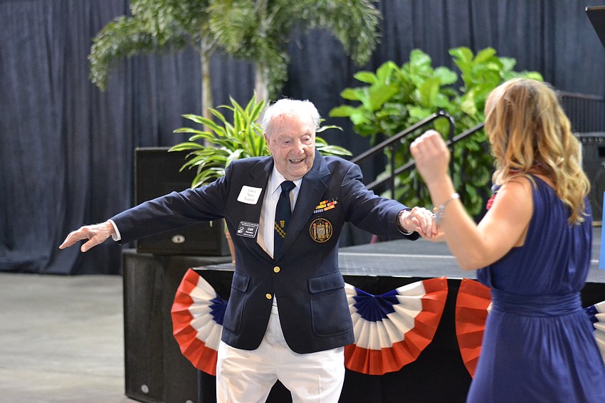 Cliff Bermann spins C.J. Bannister, director of American Veterans and Their Families initiative for Goodwill Manasota.