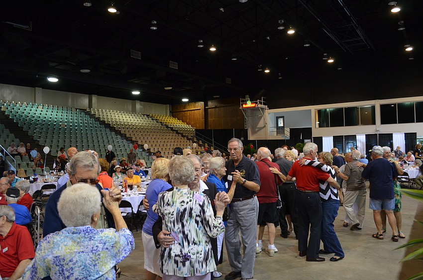 Guests fill the dance floor at Robarts Arena.