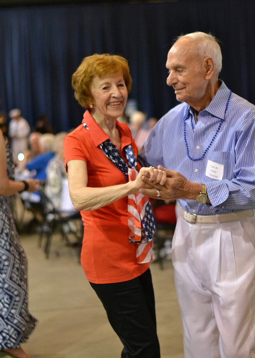 Helaina and Carmen Amadio enjoy the music at the Goodwill Manasota Spirit of '45 Dinner.