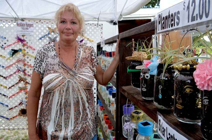 Cathy Henderson sells decorative plant holders at her Crafty Toucan store.Henderson