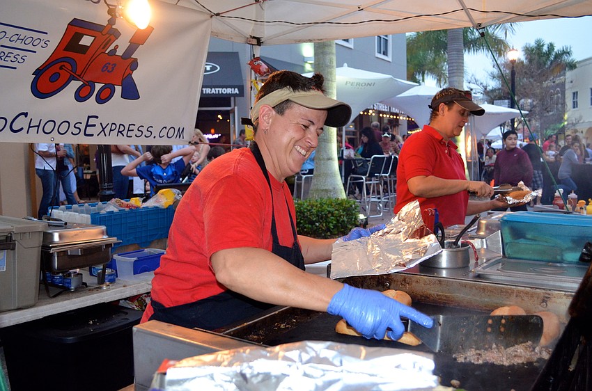 Toni Willcox serves up a sandwich for a hungry patron.