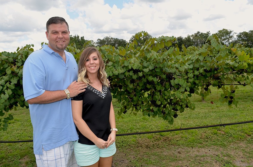 Jason and Kayla Claeys tour the 20 acres of property during the event.