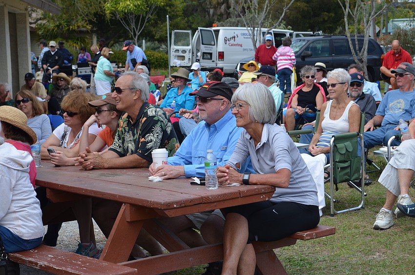 Residents listen to music at the Bluegrass Picnic at the Turtle Beach Pavilion.