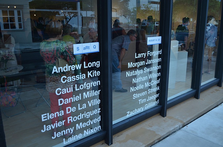 The names of the 16 artists that are a part of the SARTQ collective grace the walls of State of the Arts Gallery.