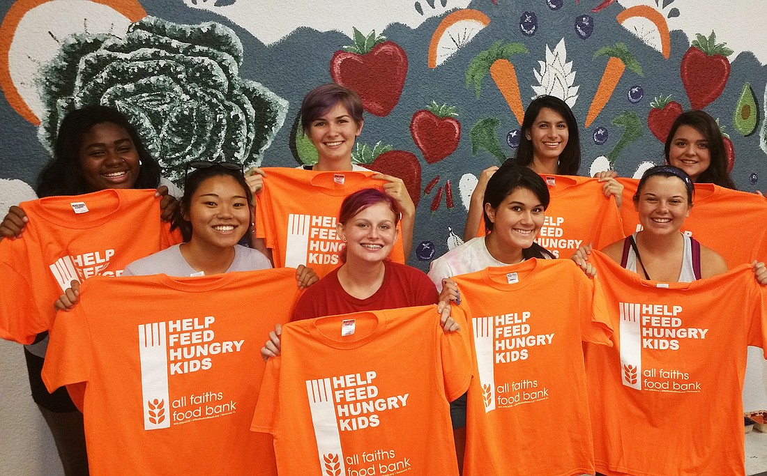 Courtesy photo. Students from Pine View School, Sarasota High School and Sarasota Military Academy contributed to a mural in the All Faiths Food Bank sorting room.