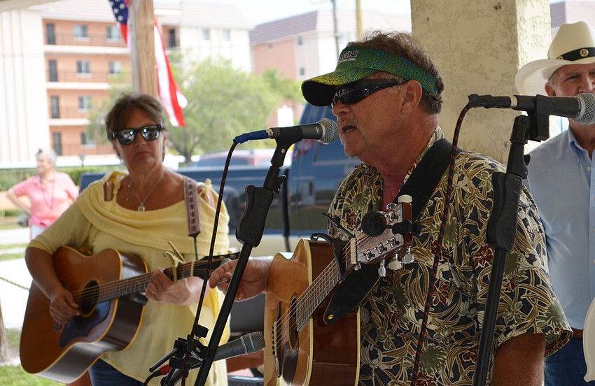 Danny Beach plays the guitar during a set at the Bluegrass Picnic.