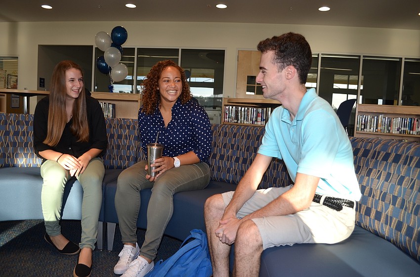 Sierra VanSuch, Sierra Dickerson and Aiden Dowdy test out the new sofa inside the common area of the Student Center.