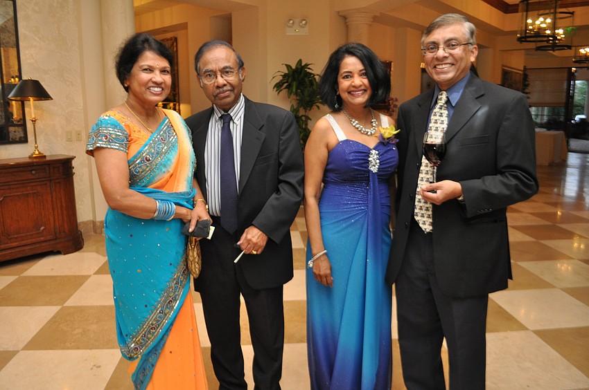 Ratna and T.K. Satya meet up with Sandy and G.B. Wick.