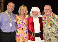 Larry Sanders, Oma McCall, Del Ralinson dressed as Santa Claus to promote the FEZtival of Trees and Andy Reeves