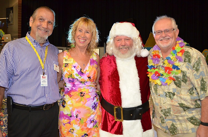 Larry Sanders, Oma McCall, Del Ralinson dressed as Santa Claus to promote the FEZtival of Trees and Andy Reeves