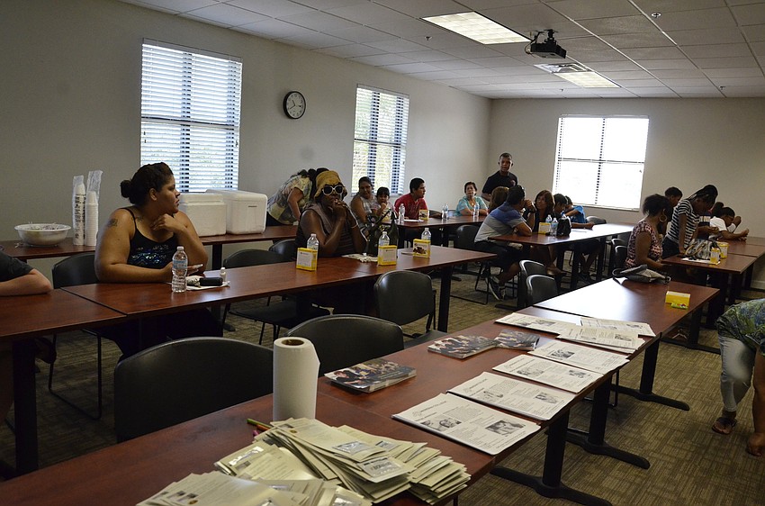 Parents wait in a classroom for their children to finish with their dental cleaning.