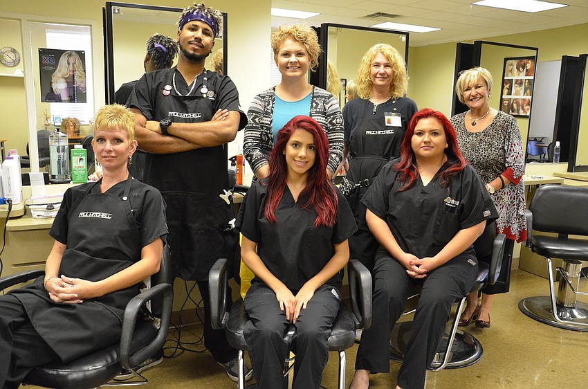 Meridian cosmetology students and instructors offered free haircuts for children. Back row: Darwin Duran, Carrie Van Metre, instructor, Francine Hazeltine and Sandy Johnson, instructor. Front row: Tamothy Pershing, Krestel Nelsen and Martha Zamora.