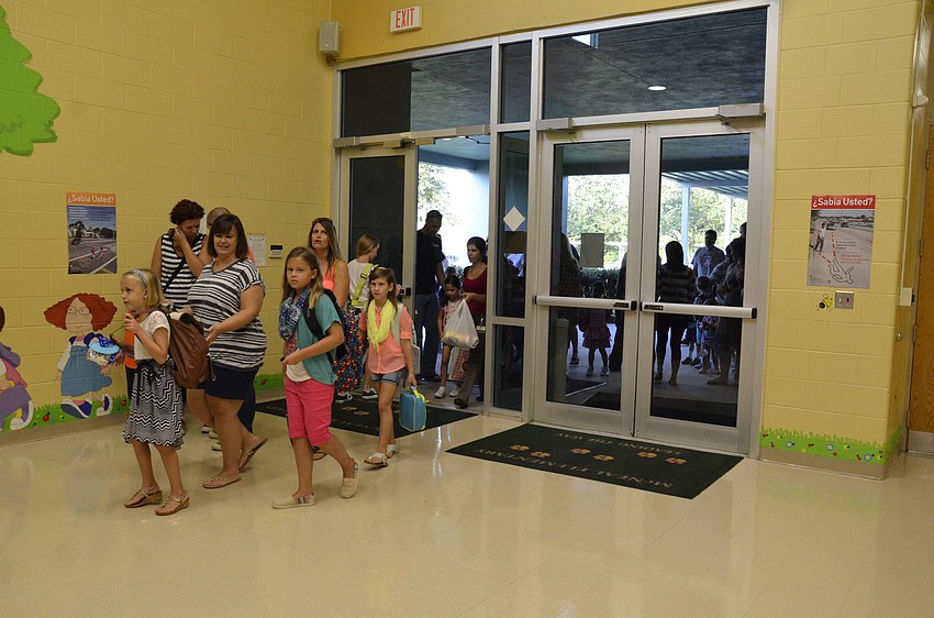 Parents and students flooded through the doors after they opened at 8:30.