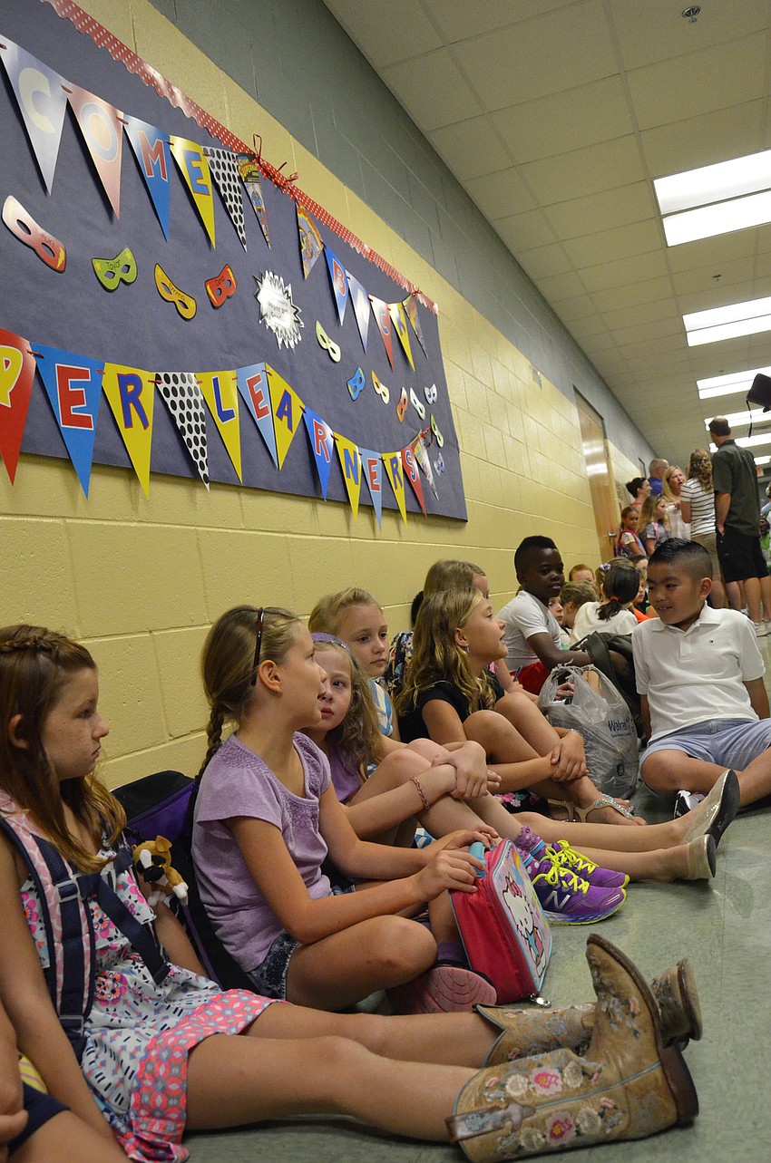 Ella Myer sits back and waits for her first day of third grade to begin.