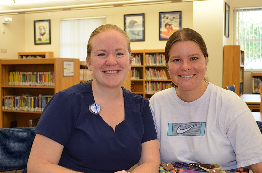 Christine Allard and Andrea Rodriguez attend the Boohoo and Yahoo breakfast at Phillippi Shores Elementary School.
