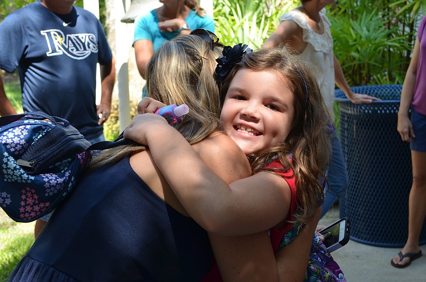 Emily Nelson hugs her mother Shannon.