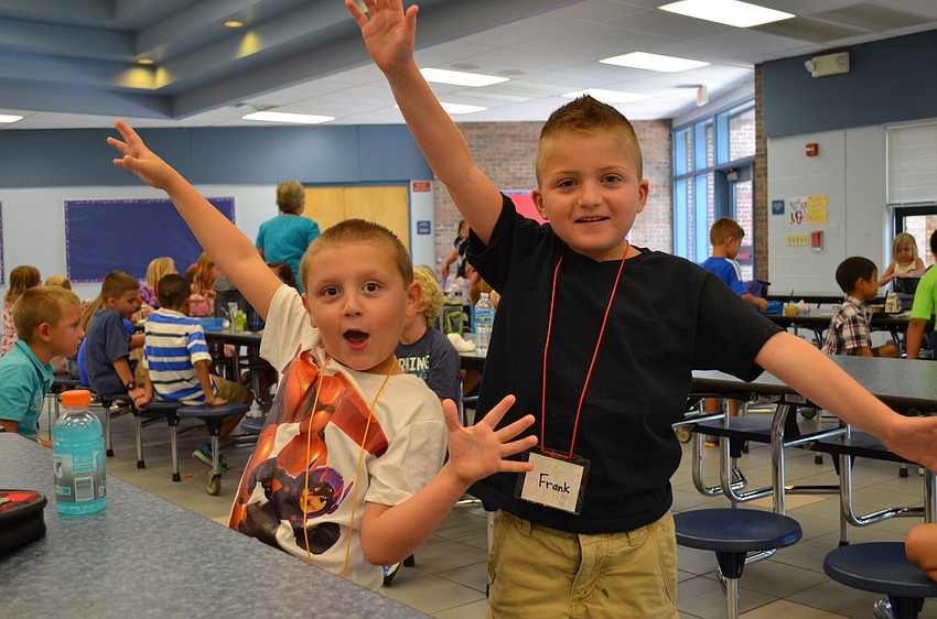 Nick Castellana and Frank Billiter show their excitement for the first day of school.