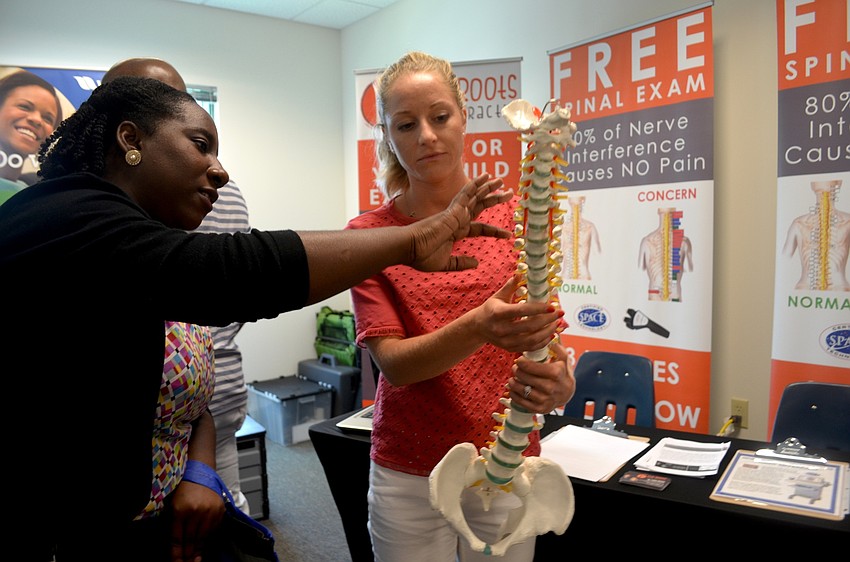 Shaneki Bradley and Dr. Laura Swaim analyze the anatomy of the spine.