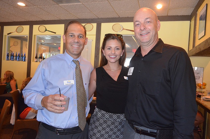 Tommy Sorrentino and Jasmine Thorne, of FBC Mortgage, and Bob MacDonald, of Custom Communications