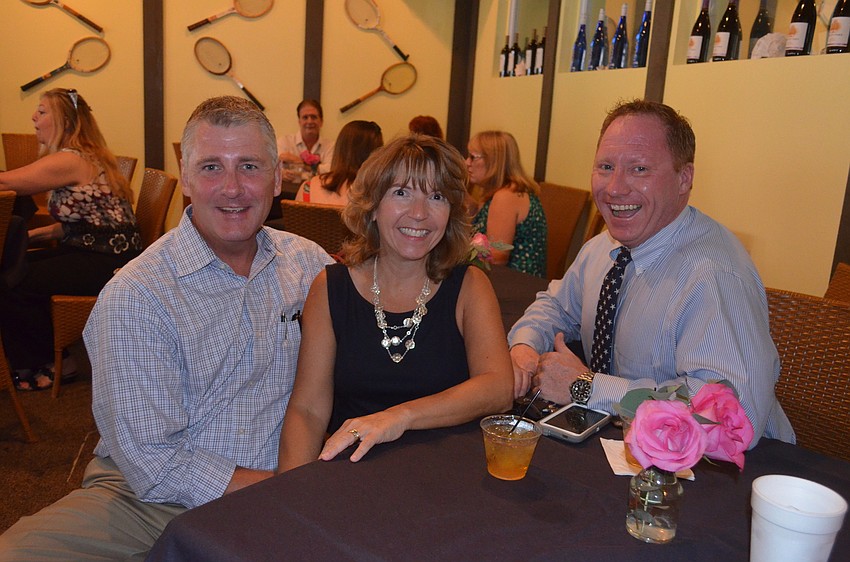 Keith and Denise Goebel and Robert Dinan, of Dinan Realty Group