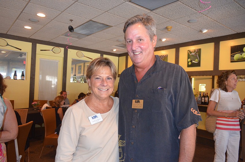 Chamber President Gail Loefgren and Michael Doll, of Longboat Key Financial Group