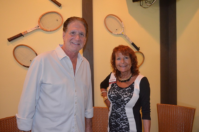 Bill Zwick, of the Longboat Key Rotary Club, Judy Tatar, of Grayhawk