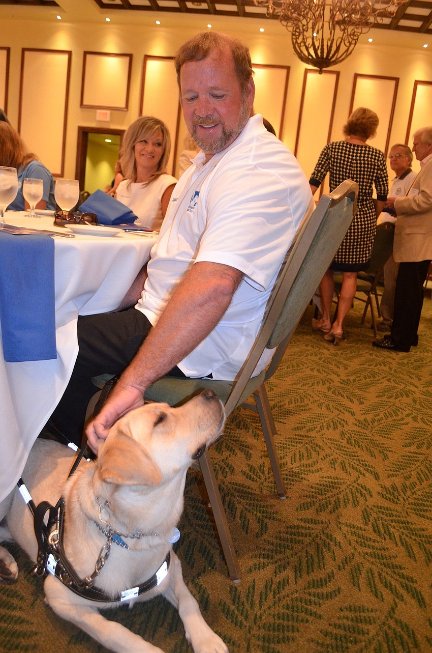 Terry Snyder and Woogie enjoy each other's company before the graduation.