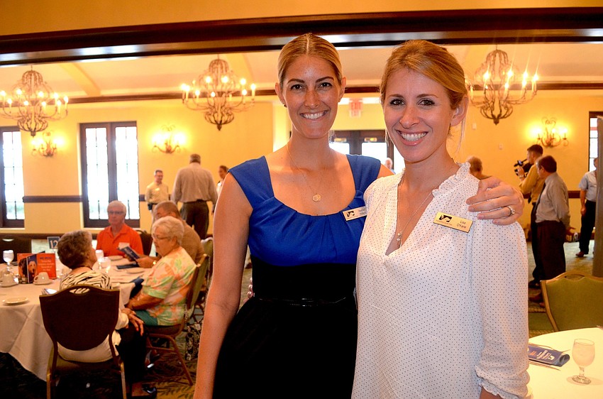 Heather Holland and Lisa O'Kane, both of Southeastern Guide Dogs, say cheese before their entrees are served.