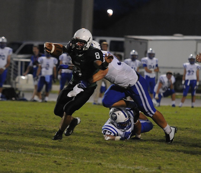 Lakewood Ranch quarterback Justin Curtis scrambles for yardage in the second quarter.