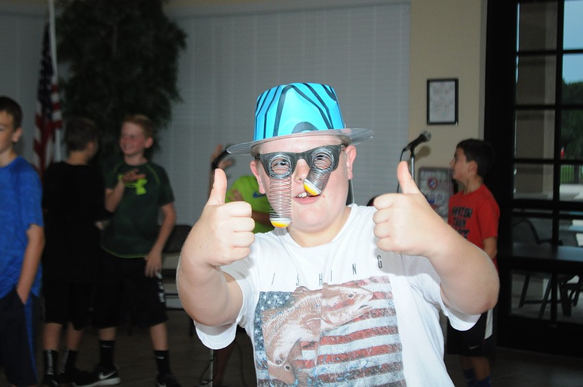 Gary Whetsell, 11, rocks a pair of googly eyes from the photo booth.