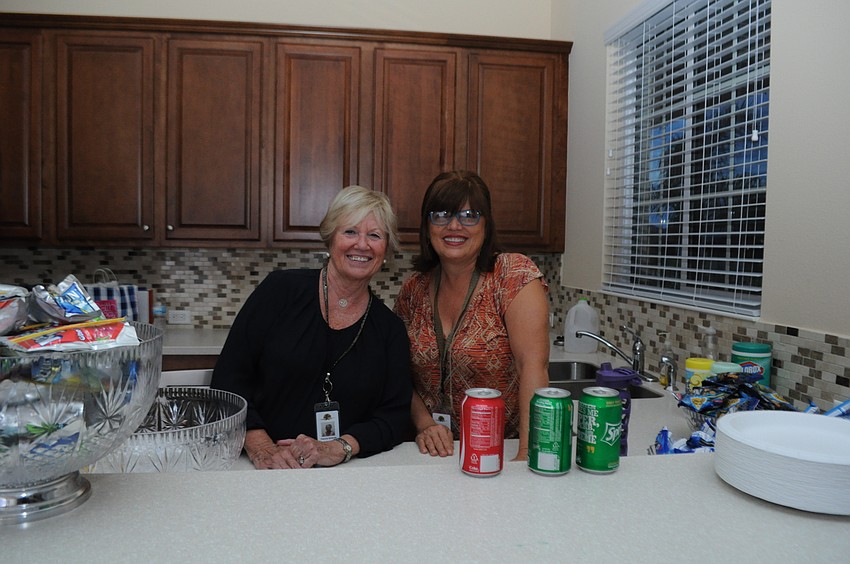 Pat Veraszto and Diane Fierle man the snacks and drinks counter.